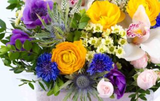 Bright buketny composition from fresh flowers, the white background